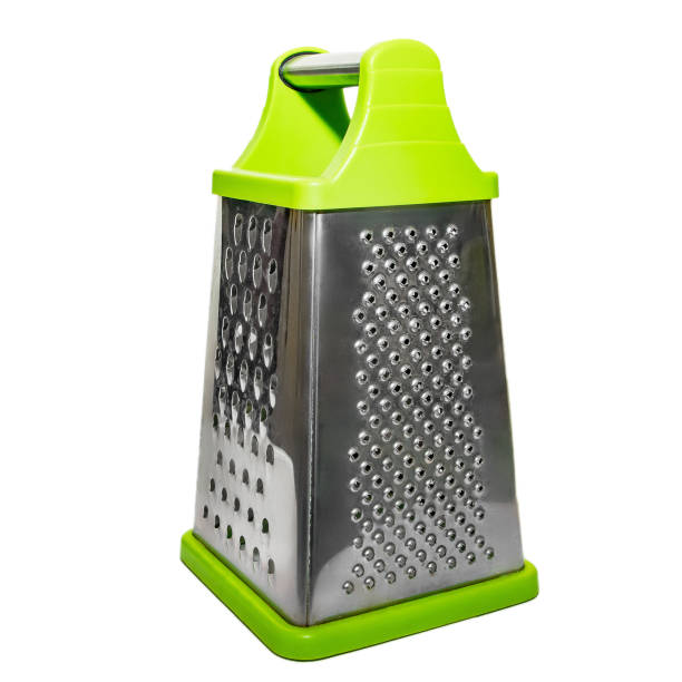Green hand grater for vegetables isolated on a white background